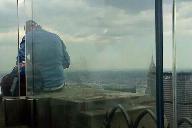 The near-Jumper sitting on a 70th floor ledge at Rockefeller Center last week